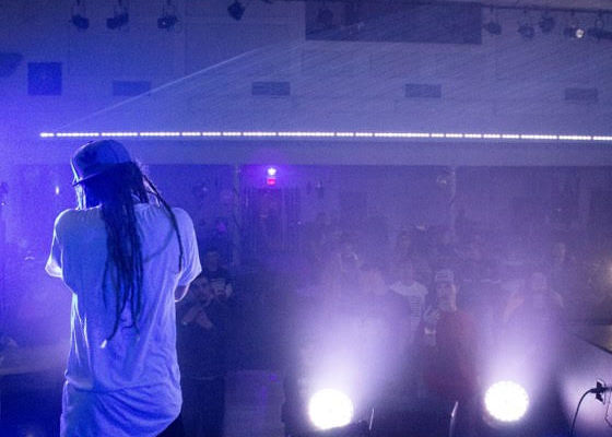 Sir Mike standing on a stage